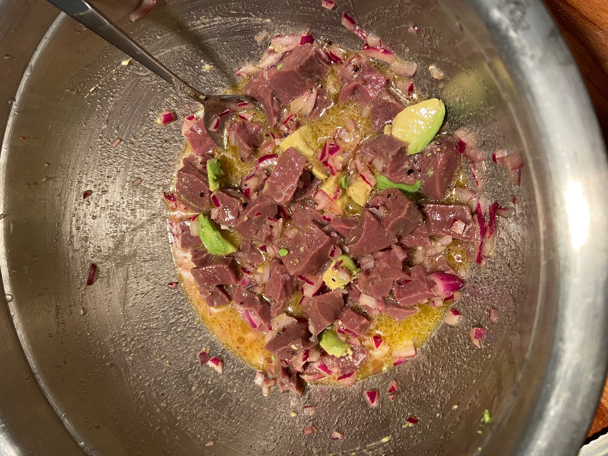 Fresh venison heart escabeche with avocado