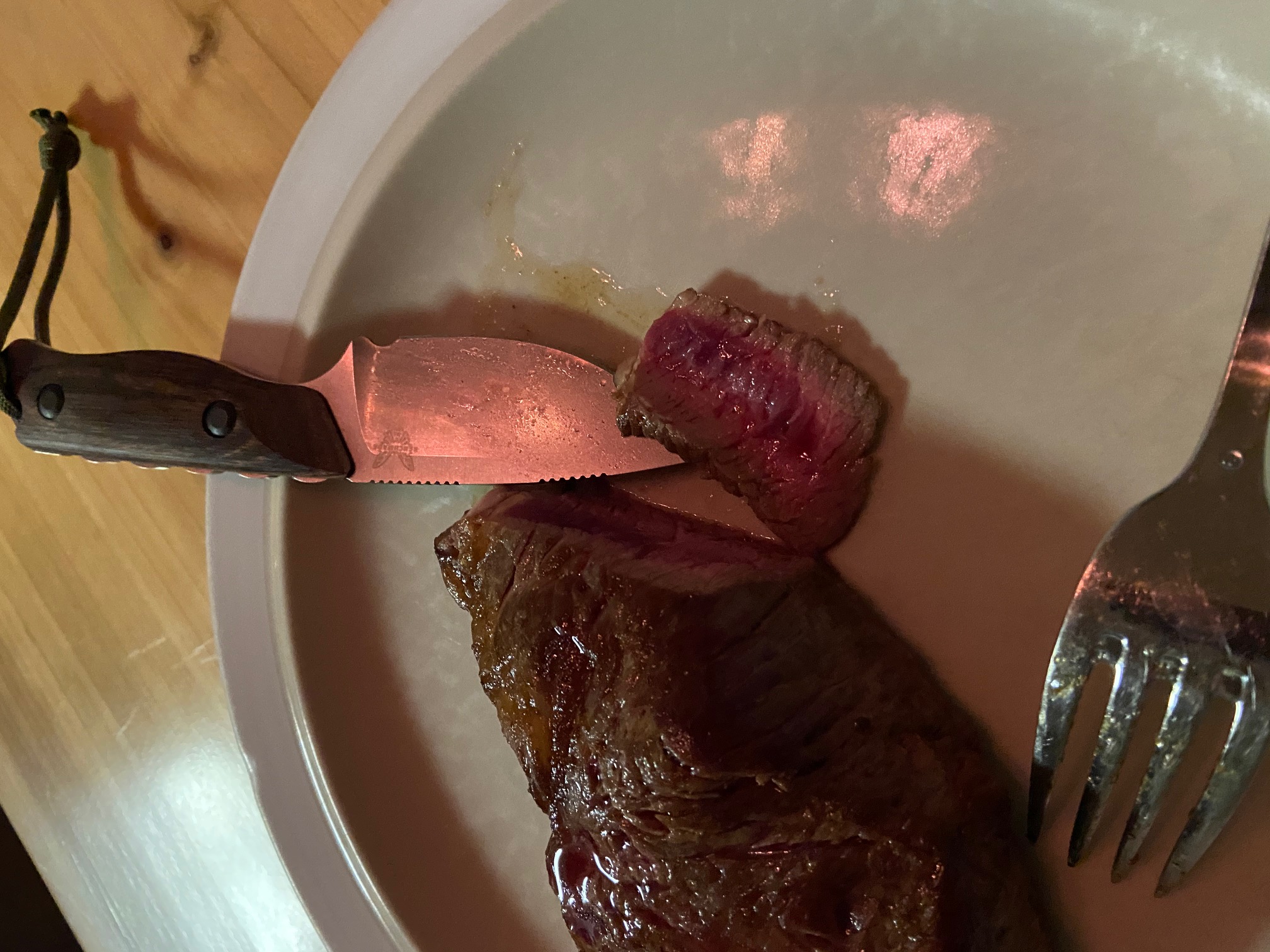 A perfectly cooked ribeye sliced with a very sharp Bench Made