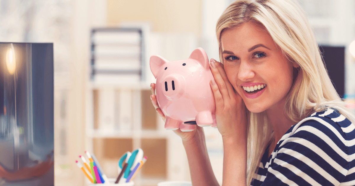 teen holding a piggy bank