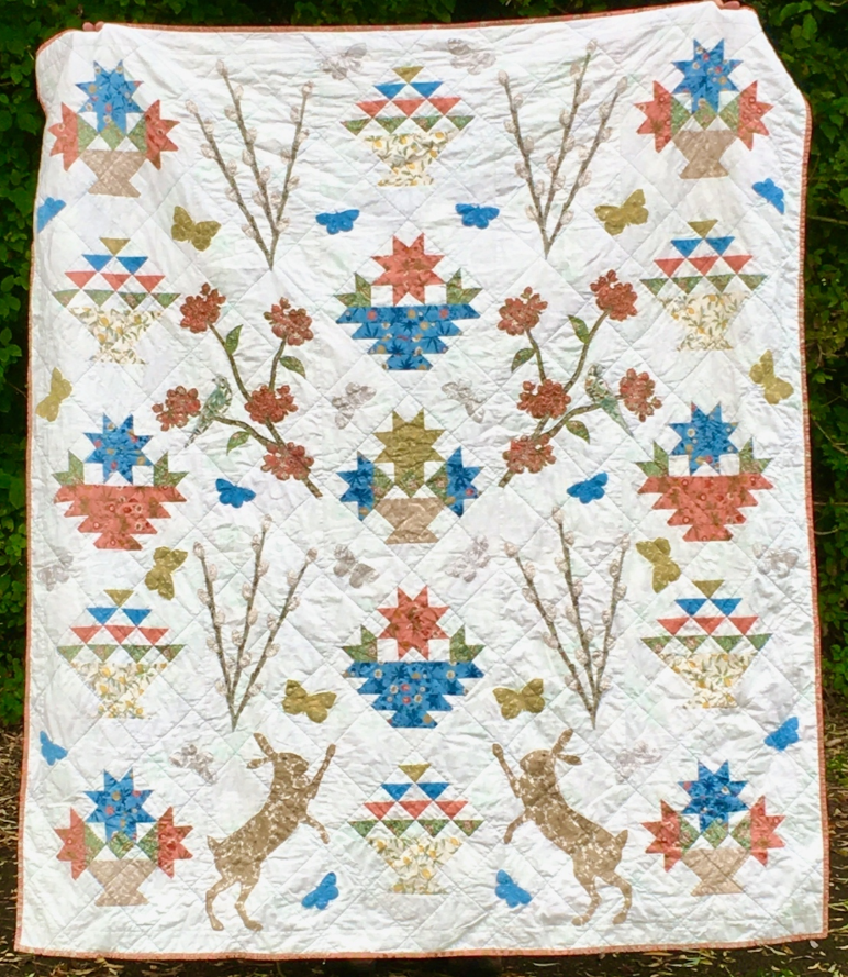 Fi Bowman Which quilt blocks make you think of spring? Fi used pieced blocks from BlockBase for this quilt and drew the applique shapes in EQ8! See more photos of the “Signs of Spring“ quilt on her Instagram, @hobgoblin.cottage!