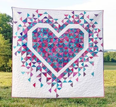 Laura Piland We're bursting with excitement for Laura! How awesome is her Exploding Hearts quilt? See more pictures (and get the pattern if you want!) on her website, SliceofPiQuilts.com. You can also follow her on Instagram @sliceofpiquilts!