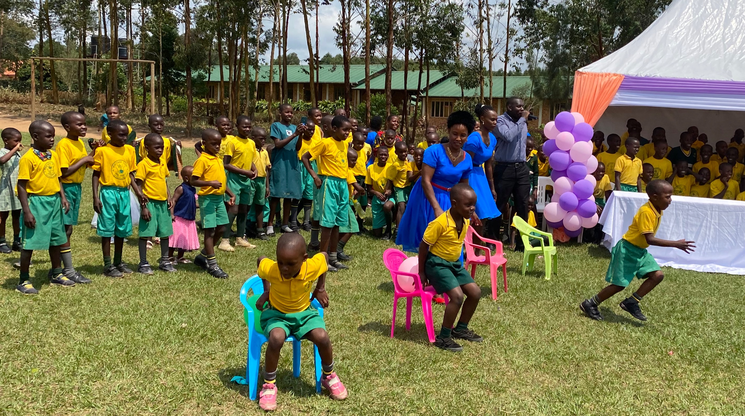 Primary School students dancing a traditional Buganda dance